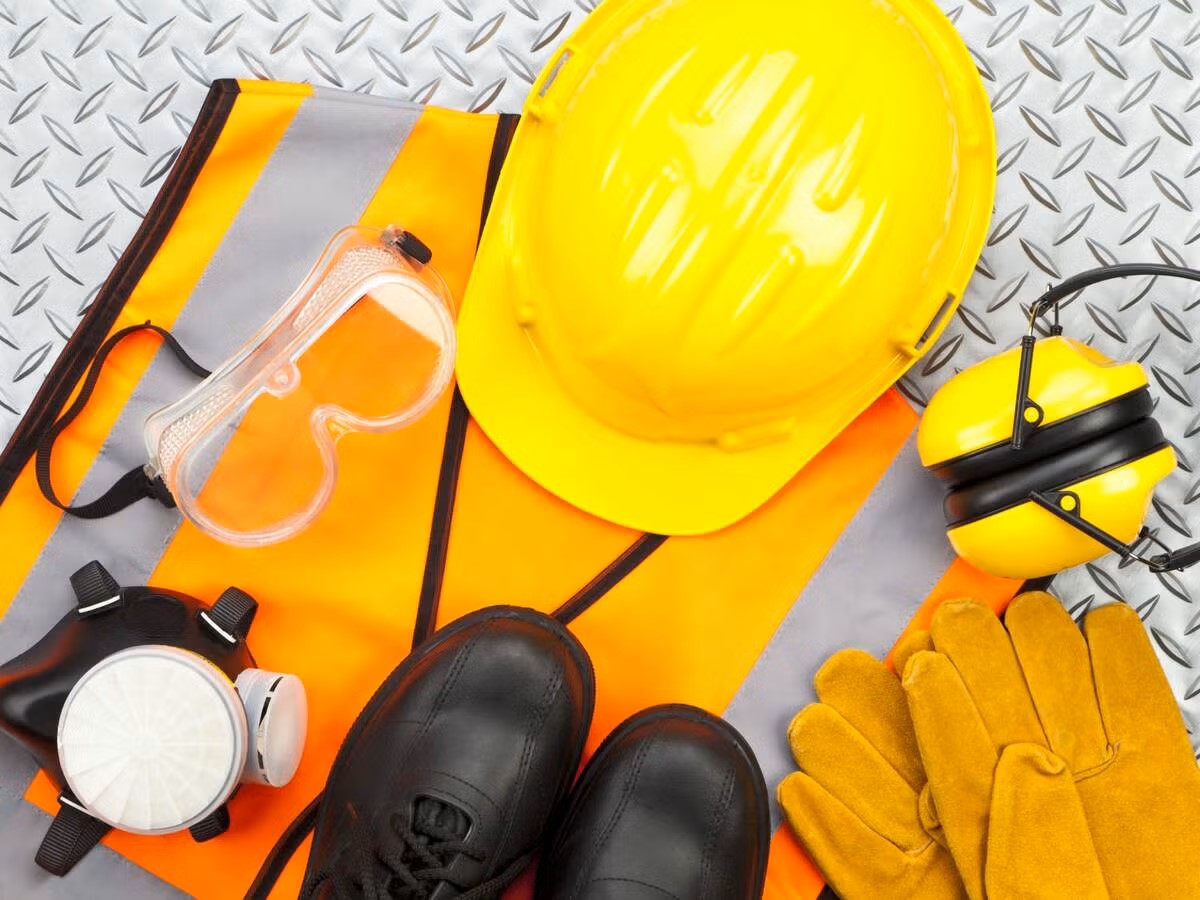 Safety helmets and protective gear arranged on table - no people